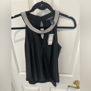 White House Black Market sleeveless top. Size XS. Excellent NWT condition.